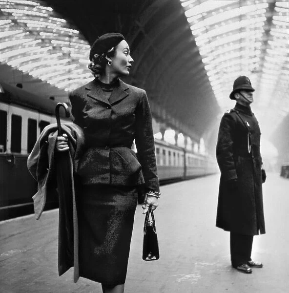 LONDON: MODEL, 1951. Fashion model Lisa Fonssagrives at Paddington Station, London, England