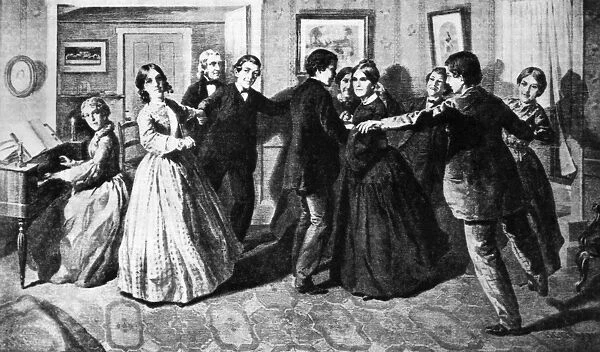 LOUISA MAY ALCOTT (1832-1888). American author. Alcott and her family in their home at Concord