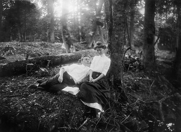 LOVERS, c1900. Courting in the woods. Posed photograph, American, c1900