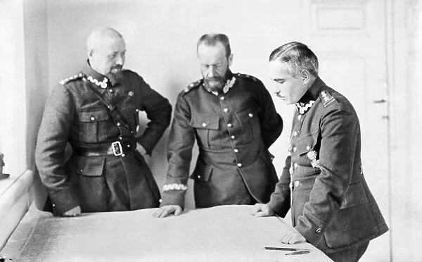LUCJAN ZELIGOWSKI (1865-1947). Polish general Lucjan Zeligowski, center, meeting