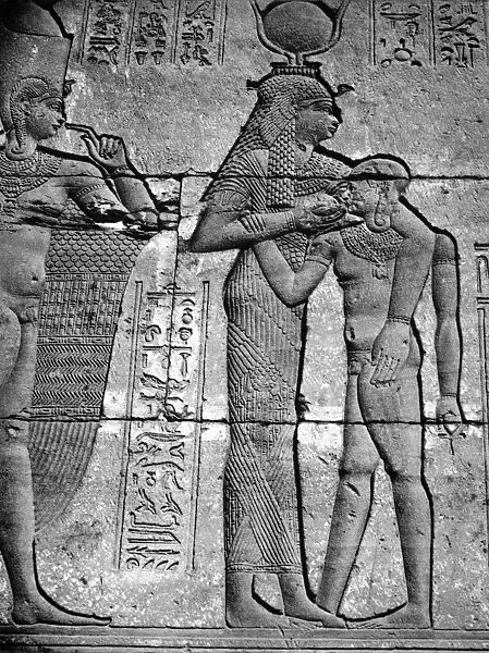 Last Macedonian queen of Egypt. Cleopatra in the form of the cow-goddess Hathor suckling a child god. Bas-relief from the Temple of Bendera, Egypt
