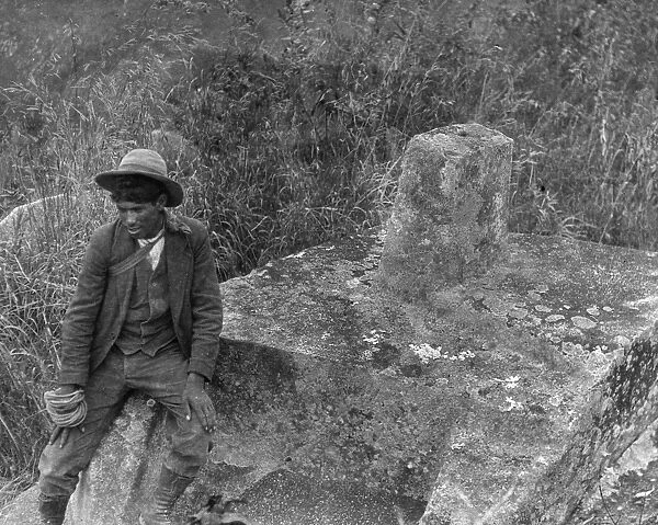 MACHU PICCHU, 1916. Benigno, a Peruvian worker, photographed, 1916, at Intihuatana