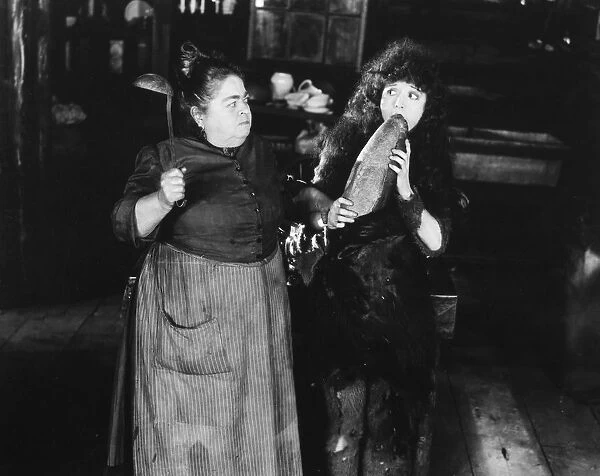 MADGE BELLAMY. Madge Bellamy (right) in a scene from a silent film of the 1920s