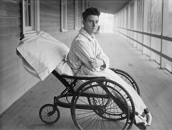 MAN, c1915. A man sitting in a wheelchair, possibly at an open air sanitorium. Photograph