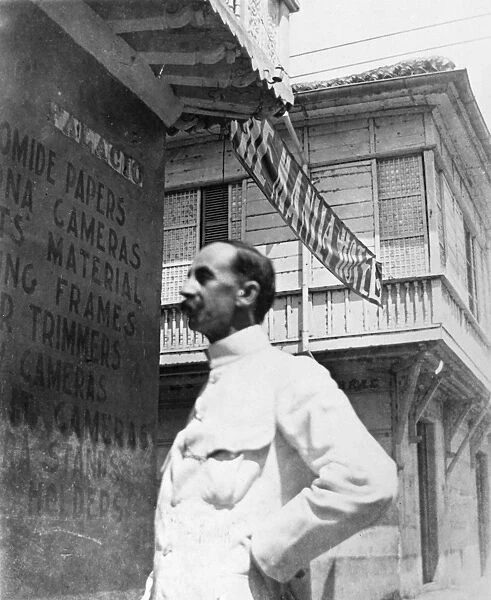 MANILA, c1900. Unidentified man, probably an American officer, in front of the Manila Hotel