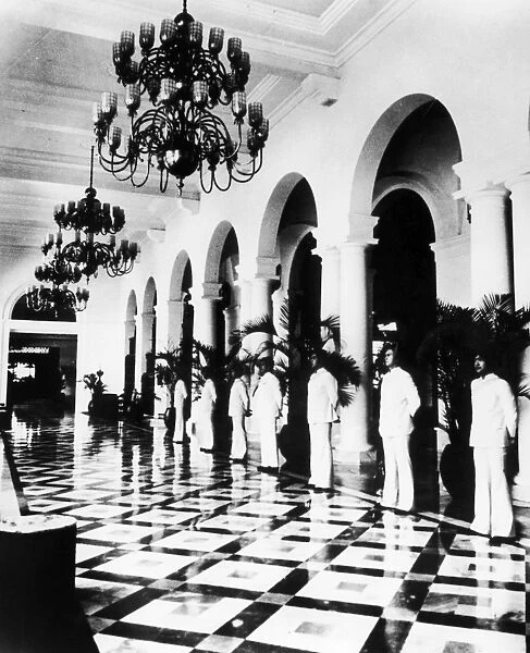 MANILA: HOTEL, 1925. Bellhops in the lobby of the luxury Manila Hotel, built, 1912