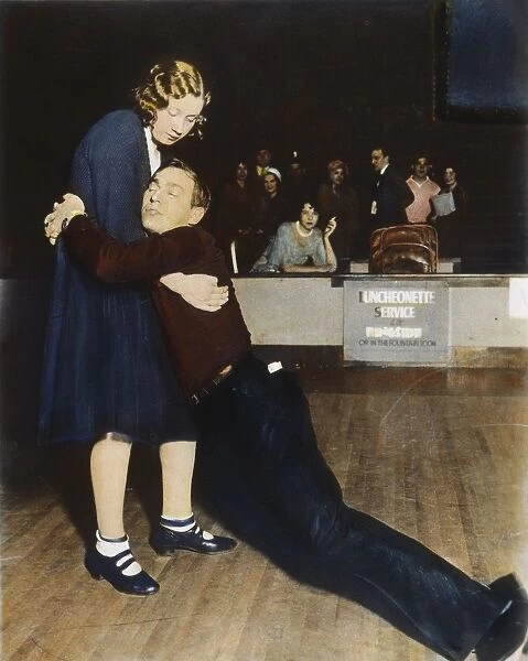 MARATHON DANCERS, 1930s. Exhausted marathon dancers in a Chicago ballroom: oil over a photograph