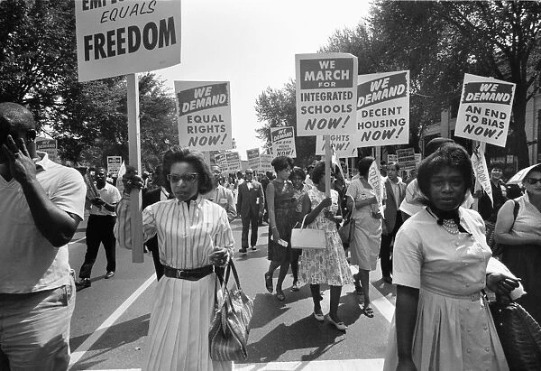MARCH ON WASHINGTON, 1963. Picketers carrying signs calling for equal rights, integrated schools, and decent housing at the March on Washington, 28 August 1963. Photographed by Warren K. Leffler
