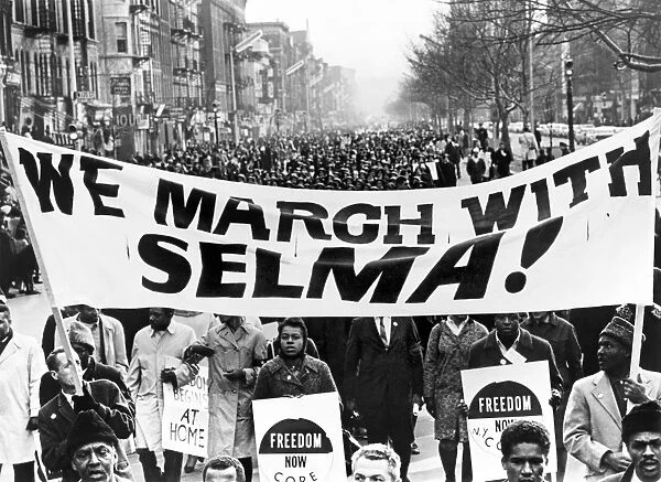 Marchers in Harlem, New York City, carrying banners in support of the Selma to Montgomery marchers. Photograph by Stanley Wolfson, 1965