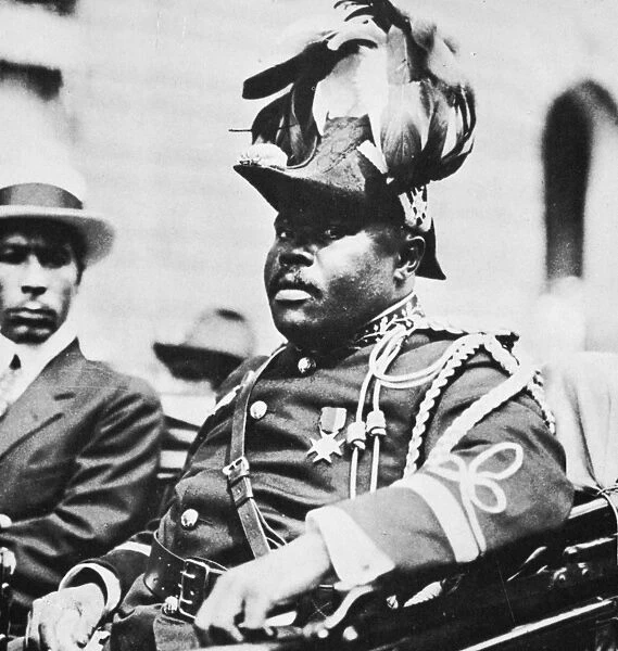MARCUS GARVEY (1887-1940). Jamaican black-nationalist leader. Photographed at a parade