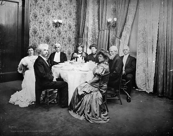 MARK TWAIN, 1905. Samuel Clemens ( Mark Twain ), second from left, photographed as the guest of honor at a celebration of his 70th birthday held at Delmonicos, New York City, 5 December 1905; other guests (left-to-right): Kate Douglas Riggs, Reverend Joseph Twichell, Bliss Carmen, Ruth Stuart, Mary E. W. Freeman, Henry M. Alden, Henry H. Rogers