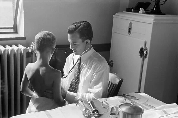 MARYLAND: DOCTOR, 1938. A doctor examining a child at preschool clinic in Greenbelt, Maryland