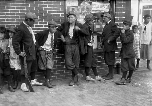 MASSACHUSETTS: GANG, c1916. A street gang of boys smoking on the corner of Margaret and Water Streets, Springfield, Massachusetts. Photographed by Lewis Hine, June 1916