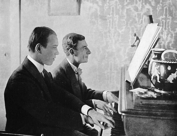 Maurice Ravel (right) with Nijinsky at the piano on the stand of which is the score of Daphnis and Chloe, 1912