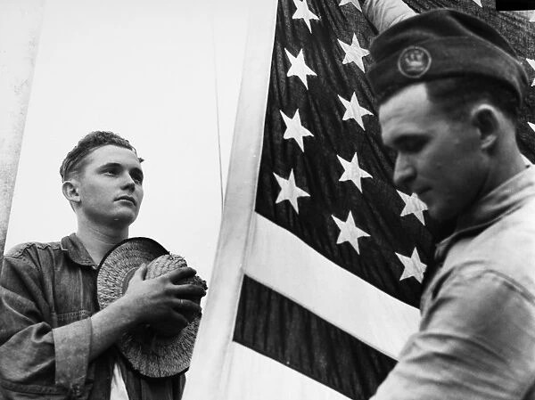 A member of the Civilian Conservation Corps saluting the flag. Photograph, c1940
