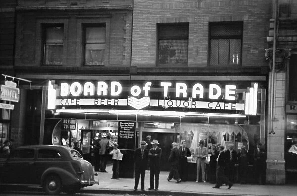 Men standing in front of the Board of Trade bar and gambling house in Butte, Montana. Photograph by Arthur Rothstein, 1939