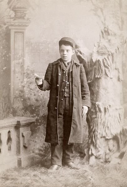 MESSENGER BOY, c1889. Portrait of a messenger boy, photographed by the Shouldis