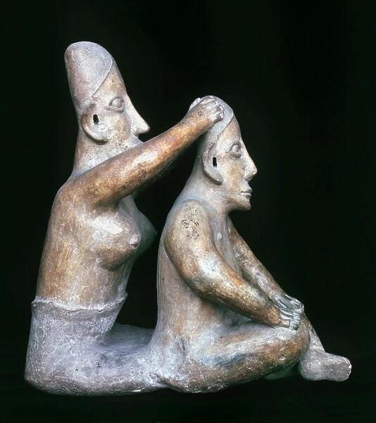 MEXICO: TOTONAC FIGURES. Ceramic figure of a woman washing a mans hair. Both show evidence of head elongation. From the Totonac culture of east-central Mexico, c200 B. C