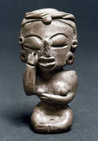 MICHOACAN: FIGURINE. Pre-Columbian figurine of a woman with her hand on her cheek. From Michoacan, Mexico