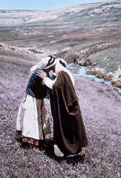 MIDDLE EAST: BEDOUINS. Two Bedouins greeting each other. Hand-colored photograph