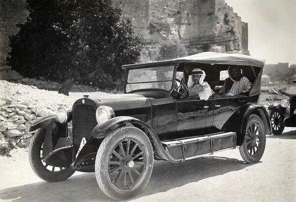 MIDDLE EAST: CAR, c1930. An Arabic man driving a car, c1930