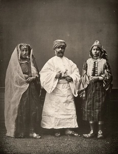 MIDDLE EASTERN DRESS, c1873. Models wearing traditional clothing from the Middle East