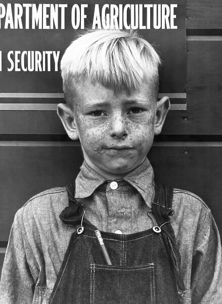 MIGRANT BOY, 1940. Boy from a migrant farm family in Visalia, California