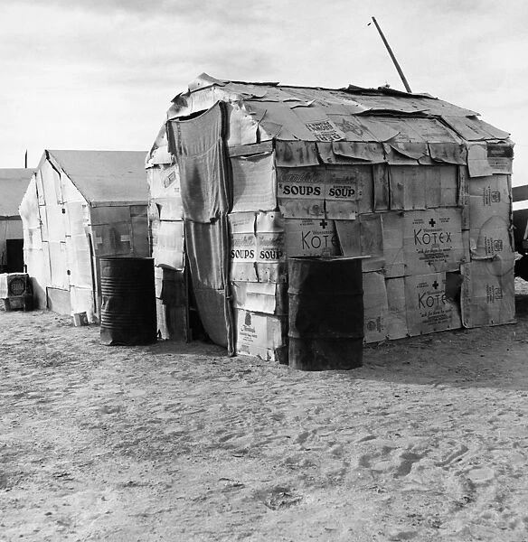 MIGRANT FARMER CAMP, 1938. Camp of cardboard houses inhabited by migrant farmers in America