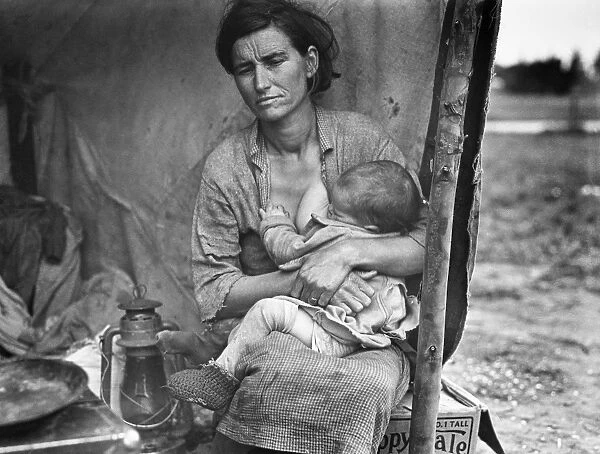 MIGRANT MOTHER, 1936. Florence Thompson, a 32-year-old migrant mother, nursing