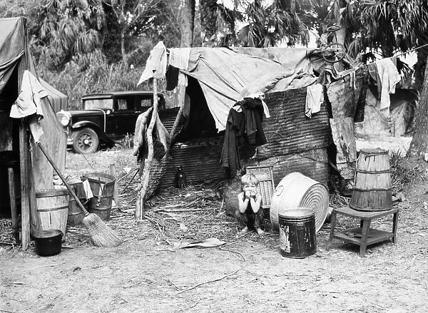 MIGRANT WORKER, 1939. A migrant workers shack in a shanty town, near Canal Point, Florida