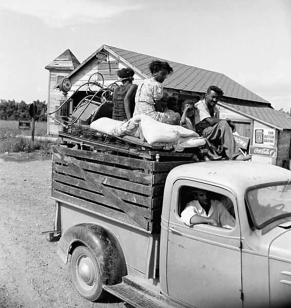 MIGRANT WORKERS, 1938. An African American family being moved from Arkansas to