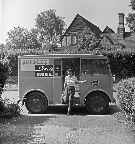 MILKMAN, 1943. Rosaleen McCarren working as a milkman in Bryn Mawr, Pennsylvania