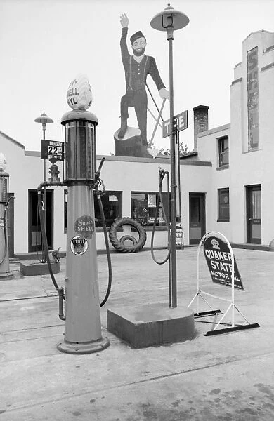 MINNESOTA, 1939. Paul Bunyan atop a gas station in Bemidji, Minnesota. Photograph by John Vachon