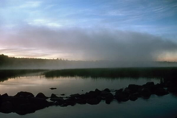 MINNESOTA: LAKE ITASCA. A view of the headwaters of the Mississippi River at Lake Itasca, Minnesota, at sunrise. Photographed c1974