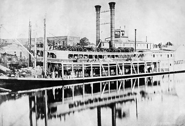 MISSISSIPPI STEAMBOAT, c1880. The steamboat David R. Powell docked along the Mississippi River
