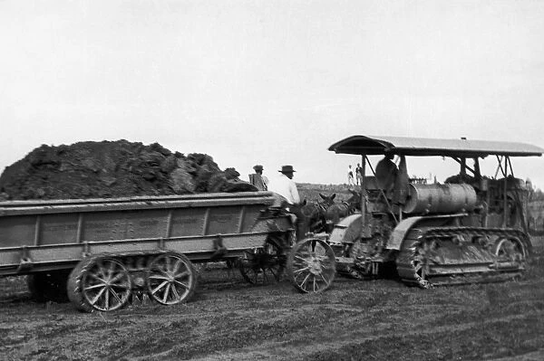 MISSOURI: LEVEES, 1927. A tractor-drawn wagon being used in a levee construction