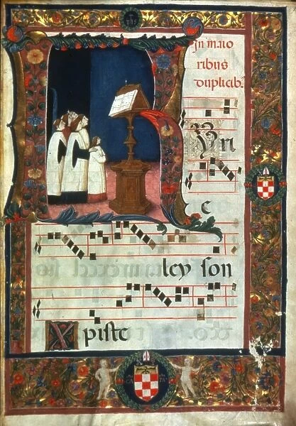 MONKS SINGING, 15th CENTURY. Monks singing from a choir book, drawn in an initial K