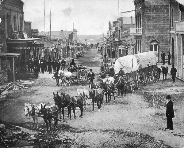 MONTANA: HELENA, c1870. A covered wagon, drawn by a team of mules, on Main Street in Helena