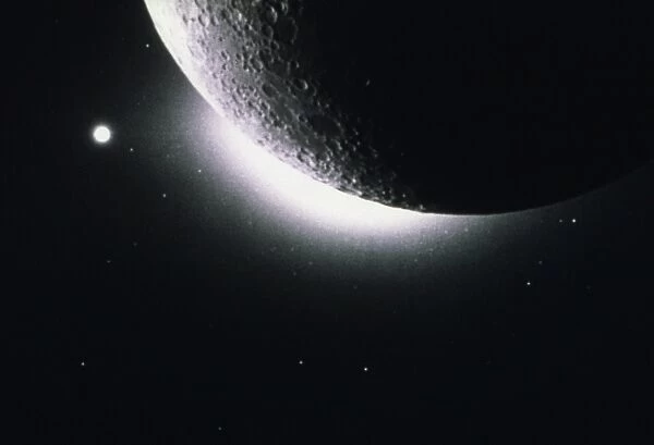 MOON: EARTHSHINE. Photograph of the moon showing the bright glow of the earthshine, light reflected off the Earth and onto the Moon. Image taken from the far side of the moon by the Star Tracker camera aboard the spacecraft Clementine, 1994
