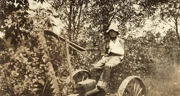 MOWING ACCIDENT, 1915. A twelve-year old boy driving the mowing machine which cut