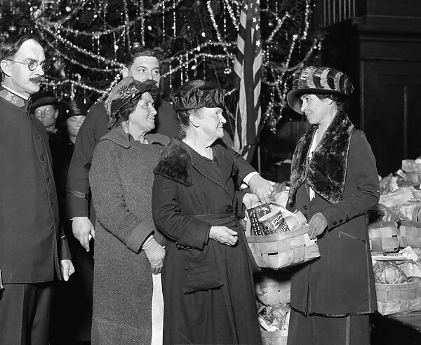 Mrs. Coolidge handing out Christmas dinner at the Salvation Army, Washington D. C. Photograph, 24 December, 1923