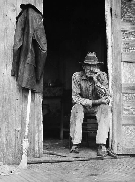 MUSKRAT TRAPPER, 1941. A Spanish muskrat trapper in the doorway of his marsh camp