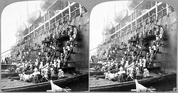 NAGASAKI: NAVAL STATION. Japanese dockworkers on a barge and scaffolding form a