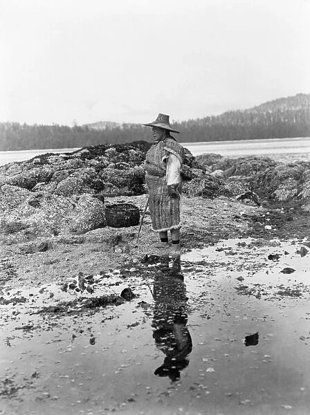 NAK WAXDA XW WOMAN, c1910. A Nak waxda xw woman standing on the beach in British Columbia