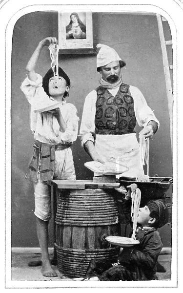 NAPLES: PEASANT, 1869. A man and two boys, peasants of Naples, Italy, eating macaroni