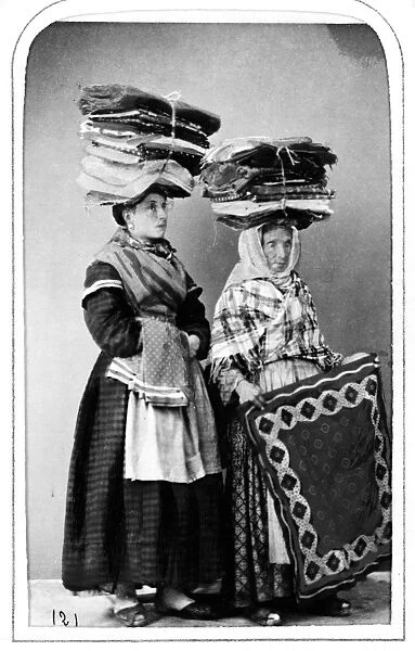 NAPLES: PEASANTS, 1869. A pair of peasant women of Naples, Italy, with carpet bundles
