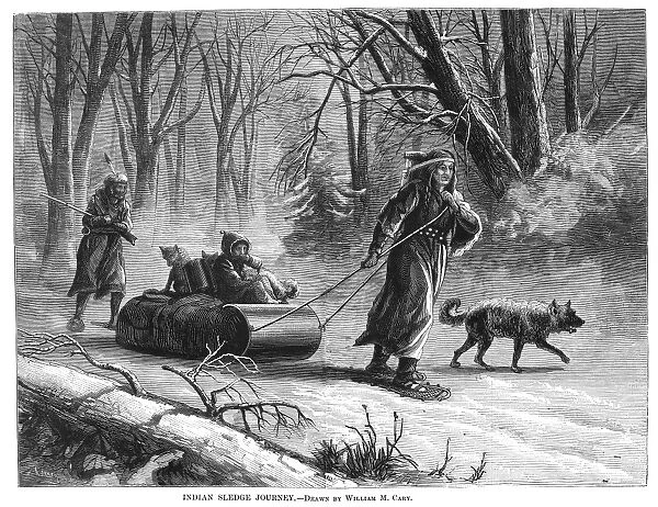 NATIVE AMERICANS: SLED, 1875. A Native American family traveling by sled and snowshoe