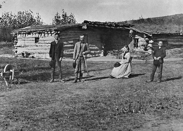 NEBRASKA: SETTLERS, 1886. The Bathrick family in front of their log house in New Helena
