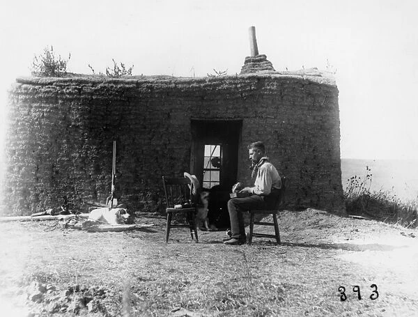 NEBRASKA: SETTLERS, 1886. Homesteader Andy Howland in front of his sod house in Custer County