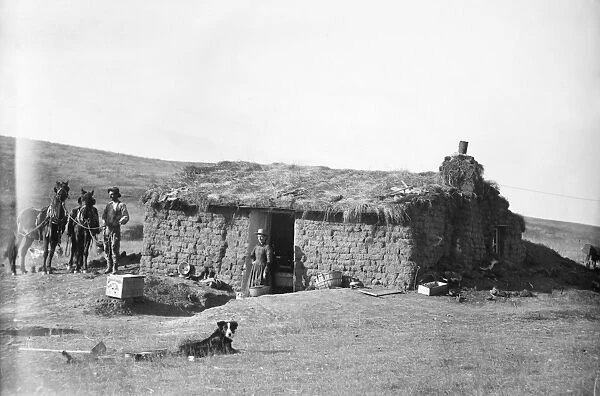 NEBRASKA: SETTLERS, c1888. A homesteader family in front of their sod house dugout